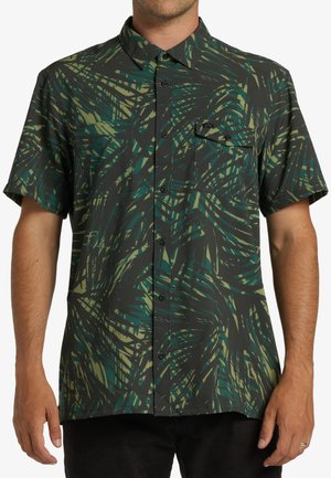 Short-sleeve button-up shirt, dark with green and yellow abstract leaf patterns, featuring a patch pocket and a standard collar.