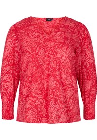 Blusa rossa a maniche lunghe con scollo a V, caratterizzata da un motivo floreale. Realizzata in tessuto leggero con polsini arricciati e una vestibilità ampia.