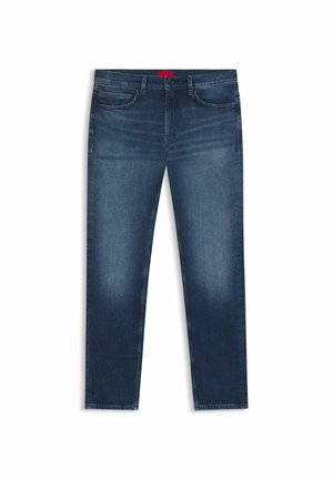 Jean en denim bleu foncé avec une coupe slim, design cinq poches, fermeture par bouton et légère décoloration sur l'avant des cuisses.