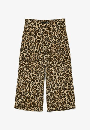 Pantalons larges en imprimé léopard fabriqués en tissu doux, dotés d'une taille élastique, de deux poches latérales et d'un fond beige neutre.