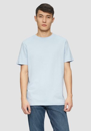 Light blue cotton t-shirt with a crew neck and short sleeves, paired with blue denim jeans. Simple, casual design with no visible patterns.