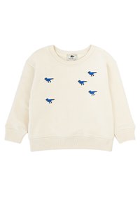 Felpa color crema realizzata in morbido tessuto, con dinosauri ricamati in blu sulla parte anteriore, e polsini e fondo a costine.