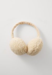 Bandeau d'oreilles en fourrure avec des coussinets ronds et doux, et un bandeau assorti, fabriqué en matériau textile, conçu pour la chaleur et le confort.