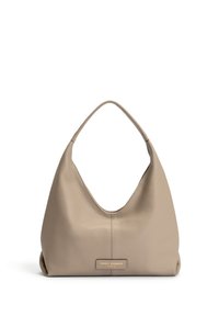 Leather shoulder bag in light beige with a smooth texture, curved silhouette, and a flat bottom. Features a gold logo plaque at the front.