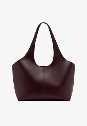 Dark brown leather tote bag with wide shoulder strap and simple seam running vertically down the center front.