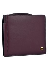 Burgundy leather wallet with a smooth texture and gold logo accent. Features a folded design and visible stitching along the edges.