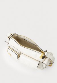 White leather crossbody bag with a textured surface, gold zippers, and detachable pockets. Interior has a beige lining.