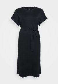 Black dress made of soft fabric, featuring short rolled sleeves, a belted waist, and side slits for mobility. Simple, straight silhouette.