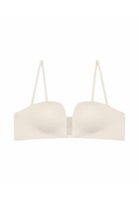 Kremowy biustonosz strapless z gładkiego materiału, formowanych miseczkach i płaskich szwach. Posiada wąskie regulowane ramiączka oraz zapięcie na hak z tyłu.