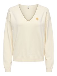 Pull à manches longues couleur crème avec col en V et petit emblème jaune de soleil sur le côté gauche de la poitrine, poignets et bandeau côtelés.