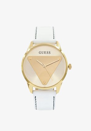 Montre dorée avec un cadran triangulaire et un bracelet en cuir blanc. Offre une aiguille des heures lisse et métallique dorée ainsi qu'un design minimaliste avec le texte de la marque.
