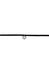 Silver heart pendant suspended on a black suede cord, displaying a smooth, reflective surface and minimalist design.