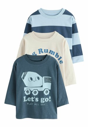 Three children's long-sleeve shirts: blue with cartoon cement truck and text, cream with partial blue text, blue and navy wide stripes.