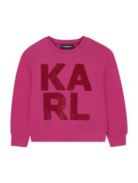Fuksjowa bluza z długim rękawem, zdobiona dużymi, cekinowymi literami "KARL" w ciemniejszym odcieniu. Gładka tkanina i ściągacze na mankietach.