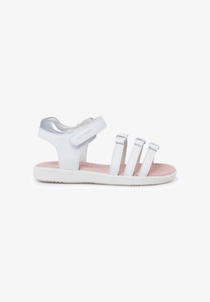 White sandal with three adjustable straps, a metallic accent on the heel, and a textured sole. Features a cushioned pink insole.