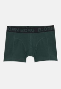 Zöld boxeralsó, puha anyagból készült, fekete derékszíjjal, amelyen a "BJÖRN BORG" logó található. Megerősített varrás és testhezálló dizájn.