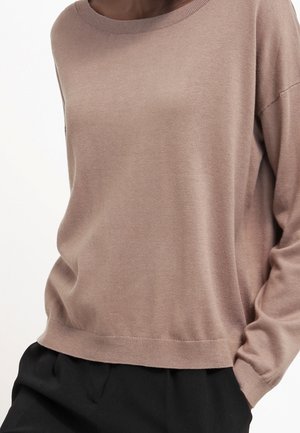 Stickad tröja - beige