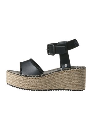 Sort læder platform sandal med ankelrem, vævet jutestål og side spænde, vist på hvid baggrund.