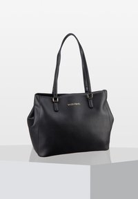 Black leather tote bag with dual handles, textured surface, and gold logo accent; spacious design with a structured shape and minimalistic style.