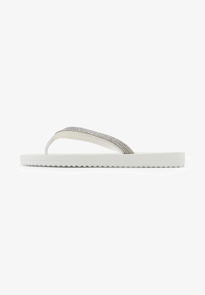 White flip-flops with a textured sole, featuring a glossy strap adorned with silver rhinestones. The design is simple and flat.