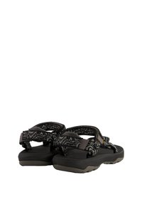 Black and gray patterned sandals with adjustable straps, sturdy rubber sole, textured footbed, and additional grip features for traction.