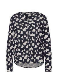 Blusa a maniche lunghe in un motivo geometrico blu navy e bianco. Presenta un scollo a V e una patta con bottoni, con un orlo posteriore leggermente più lungo.
