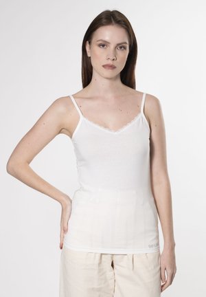 Hvid bomulds-camisole med justerbare stropper, prydet med en v-udskæring med blonderkant. Glat tekstur og tætsiddende silhuet.