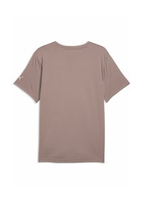 T-shirt en jersey à manches courtes de couleur mauve douce, fabriqué en tissu lisse. Dispose d'un col rond et d'un logo subtil sur la manche gauche.