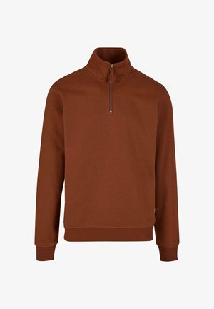 Sweat à zip marron avec col montant, fabriqué en tissu doux et texturé. Dispose de manches longues et de poignets et d'ourlet côtelés.
