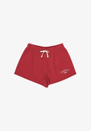 Red athletic shorts made of soft cotton, featuring an elastic waistband with drawstring and a small logo printed on the lower side.