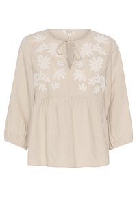 Vaaleanbeige pellavapusero, jossa pitkät hihat, solmittava kaulus ja valkoinen kukkakirjailu rintamuksessa. Rennon istuva, vyötäröltä poimutettu.