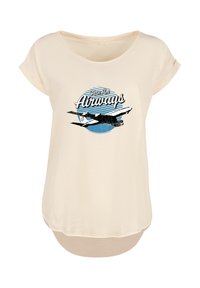 Beige short-sleeve T-shirt featuring a graphic print of a plane and text "Pan Am Airways" against a blue circular background.