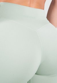 Smilodox ADVANCE PRO MID RISE YOGA SPORT FITNESS - Leggings - grün