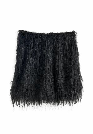 Black fringed skirt made of textured fabric, featuring long strands and metallic accents for added detail. Lightweight and flowy design.