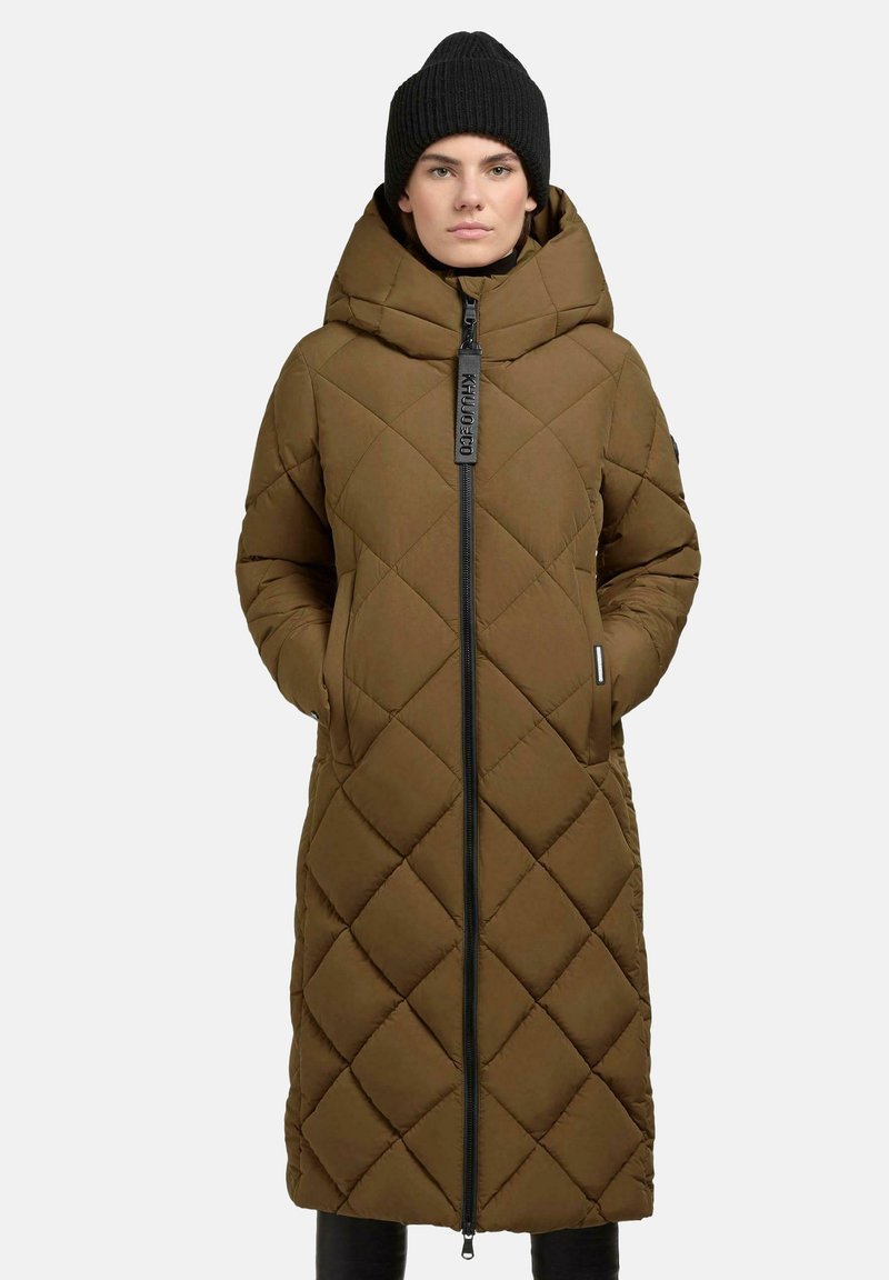 Long brown quilted puffer coat with a high collar, full zip front, and side pockets. Textured fabric with diamond patterns and black accents.
