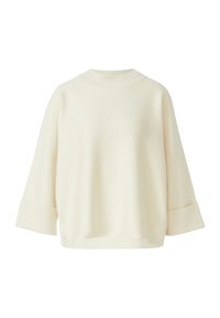 Cream-colored oversized sweater with a rounded neckline, three-quarter sleeves, and a soft, textured fabric. No patterns or hardware visible.