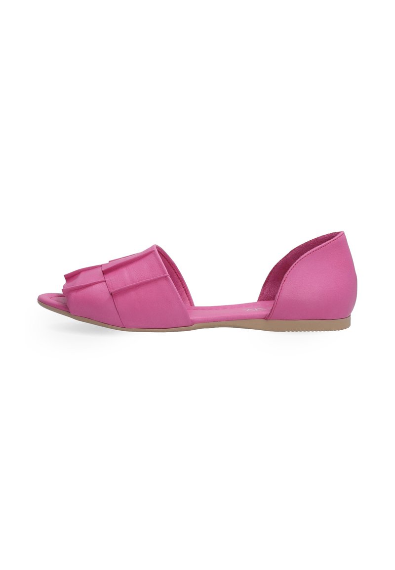 Pink flat sandals with a wide bow detail on the front, open-toe design, and a low heel, featuring a smooth texture and a simple profile.