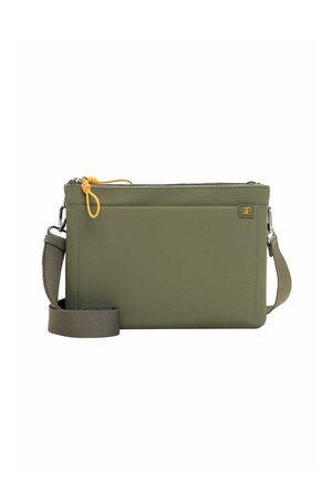 Olive green crossbody bag with adjustable strap, front pocket, top zipper with orange pull tab, and small square logo patch.