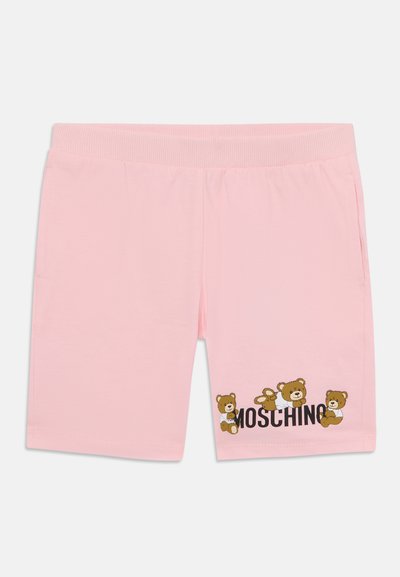 Rožinės medvilninės šortai su meškiukų grafika ir „Moschino“ tekstu. Elastinga juosmens juosta, dvi šoninės kišenės ir glotni tekstūra.