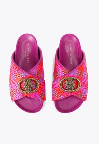 Woven slides in vibrant pink and red, featuring a crossed design and a decorative gold-tone buckle with intricate detailing.
