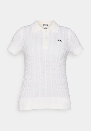 White cable-knit polo shirt with a ribbed hem, short sleeves, and a collared neckline. Features black logo on the left side.