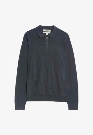 Polo en coton bleu marine à manches longues avec un col zippé ; présente un motif en chevrons texturé sur le devant et des poignets côtelés.