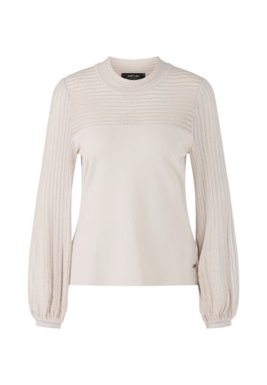 Beige long-sleeve top featuring a ribbed texture on the shoulders, balloon sleeves, and a smooth body. Subtle sheen in the fabric.
