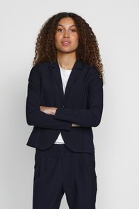 Navy blazer with a tailored fit, single button closure, and structured shoulders, paired with matching trousers, made of soft fabric.