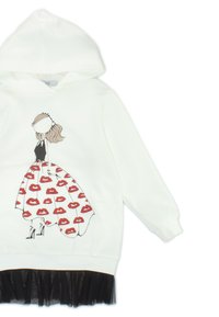 Felpa bianca con un design da cartone animato di una figura in top nero e gonna stampata con labbra rosse. Presenta un orlo in tulle nero.