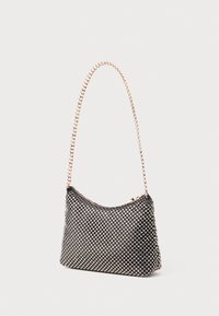 Black and silver handbag with a textured mesh exterior and a curved shape. Features a gold chain strap and a zip closure on top.