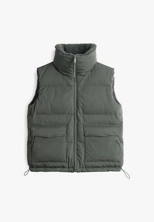 Dunkelgrüne wattierte Weste mit hohem Kragen, Reißverschluss und zwei vorderen Taschen mit Klappen. Weiche Innenauskleidung.