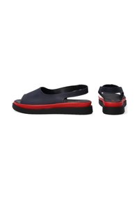 Slingback sandals with a dark blue upper, red midsole, and black sole. Open toe and heel design with minimal stitching detail.