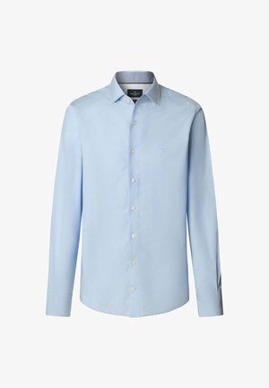 Světle modrá košile s dlouhým rukávem vyrobená z hladké tkaniny, s límečkem na knoflíky a předním zapínáním. Malé logo vyšitá na hrudi.
