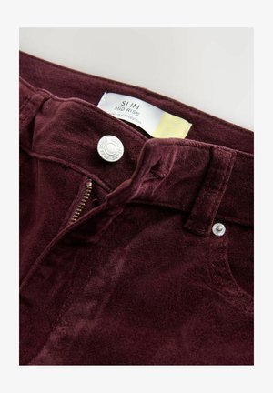 Bordeaux slim mid-rise jeans met een textuurafwerking, zilveren hardware en een ritssluiting. Etiket geeft aan dat het is gemaakt in Cambodja.